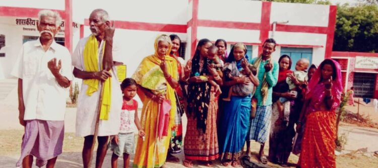 An elated group of voters posing after exercising their votes, image source ECI