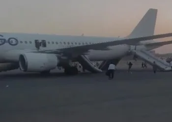 Passengers of the IndiGo flight are seen being evacuated via an emergency exit following the bomb threat