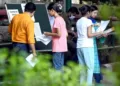 Students outside exam center (Image Source: Zee Business)