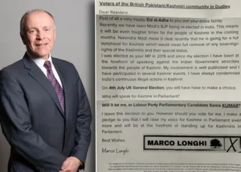 British Conservative Party Leader Marco Longhi with his leaflet.