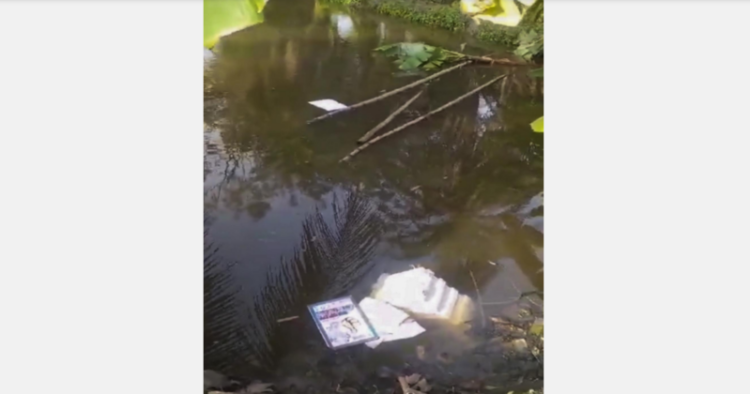 Election material thrown in a pond by some miscreants during the seventh and last phase of Lok Sabha elections, at Kultali in South 24 Parganas district, on June 1, 2024 | Photo Credit: PTI