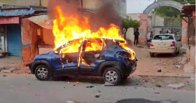 A car set ablaze during post-poll violence (File Image: Pic Credit: Indian Express)