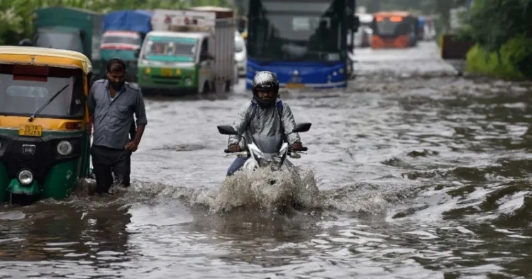 The image shows a waterlogged roads in Delhi due to heavy rains.
