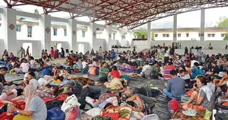 People evacuated from violence-affected areas take rest at a shelter (Source: ANI)