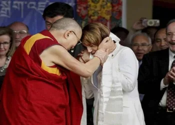 Dalai Lama giving a stole to Nancy Nancy Pelosi