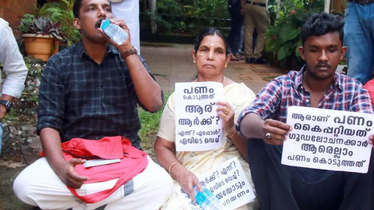 Pramod Kottooli, family and colleagues stage dharna