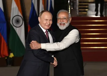 Left: Russian President Vladimir Putin, Right PM Modi