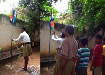 A Swayamsevak hoisting national flag (Image Source: Vishwa Samvad Kendra)