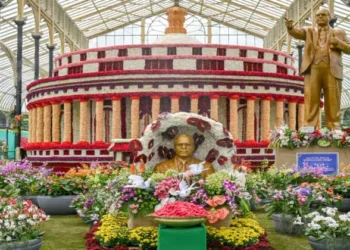 A 12-foot-tall statue of Dr Ambedkar alongside a floral model of the Parliament at the Lalbagh Flower Show