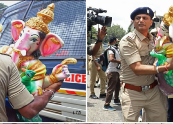 Karnataka Police carrying the Ganesh murti and putting them in the police van