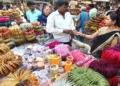 Women purchase bangles at a crowded market on the eve of the Karva Chauth festival