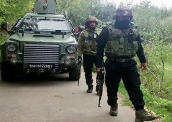 Indian Army personnel stand guard during a joint operation after three unidentified terrorists were killed during an anti-militancy operation