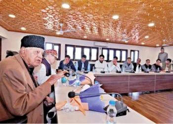 Jammu and Kashmir National Conference Party president Farooq Abdullah chairs a meeting of party MLAs following the party's win in Jammu and Kashmir Assembly elections, at party headquarters in Srinagar. Party vice president Omar Abdullah is also present