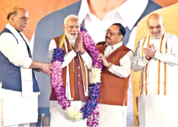 Prime Minister Narendra Modi being garlanded by Bharatiya Janata Party National President JP Nadda, Union Home Minister Amit Shah and Defence Minister Rajnath Singh after the party's victory in the Haryana Assembly and good performance in the  Jammu & Kashmir elections, at the party headquarters in New Delhi