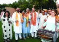 Bharatiya Janata Party's Haryana President Mohan Lal Badoli and BJP supporters show the victory sign to celebrate the party's win in the state assembly election