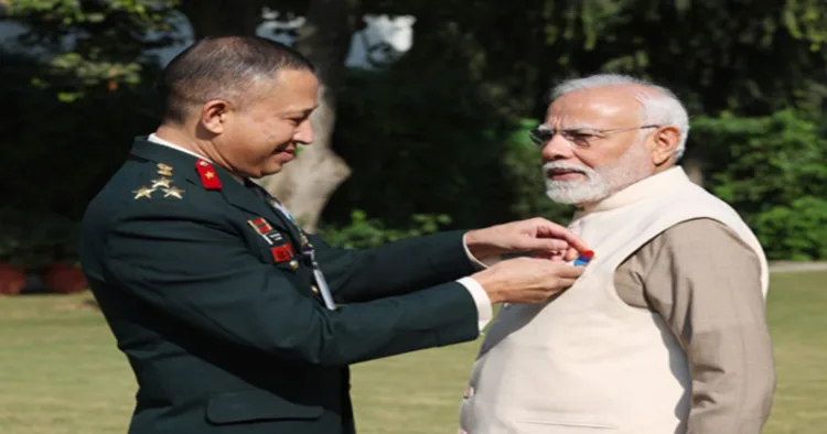 A defence official pinned the Armed Forces Flag on PM Modi (Image Source X)