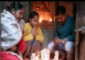 Devotees perform puja at the Hindu temple in Aligarh after ot was restored