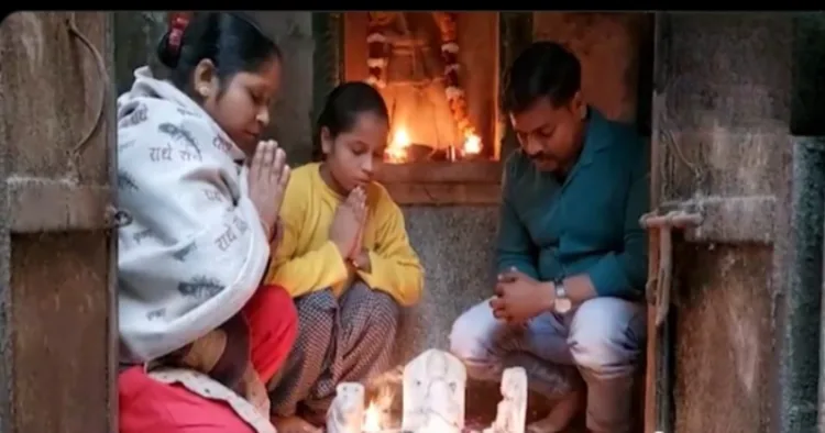 Devotees perform puja at the Hindu temple in Aligarh after ot was restored