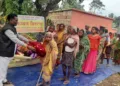 Vanvasi Kalyan Ashram workers distributing blankets to the needy individuals of the tribal community in Mayurbhanj district.