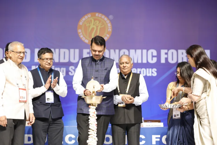 Maharashtra Chief Minister Devendra Fadnavis & others lighting the ceremonial lamp to inaugurate the World Hindu Economic Forum 2024, in Mumbai