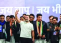 Congress MP & Lok Sabha LoP Rahul Gandhi waving to the gathering during a public rally ahead of the Delhi Assembly elections, at Seelampur in Delhi