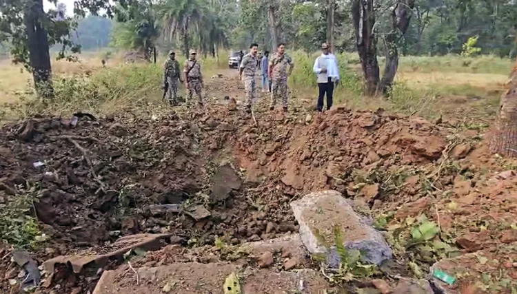 Security personnel at the site where an IED blast occurred on the security force's vehicle, in Bijapur on Monday. Reportedly, eight Dantewada DRG jawans and one driver lost their lives in the incident. (ANI Photo)