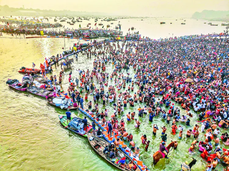 Prayagraj, Jan 14 (ANI): An aerial view of the devotees taking a dip at Triveni Sangam on the occasion of ‘Makar Sankranti’ during the ongoing Maha Kumbh 2025, in Prayagraj on Tuesday. (ANI Photo)