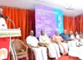 T. Satisan speaks. L/R:  Vijayakumar Master, Adv. Thampan Thomas, E.N. Nandakumar, Dr. Sebastian Paul, M.I. Mayadevi, Lalita Prakash, Latika Vijayan, Santa Nandakumar Pai.