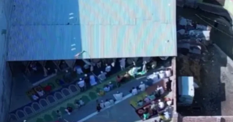 Screengrab from drone footage of people offering namaz at the makeshift mosque. (Source: X)