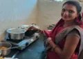 A tribal woman cooking food on gas stove in Madhya Pradesh's Shivpuri (Photo: Subhi Vishwakarma)