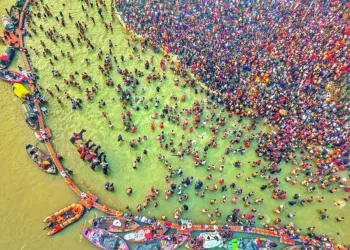 An aerial view of Triveni Sangam as devotees take a dip during the ongoing 'Mahakumbh Mela 2025', in Prayagraj