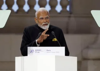 Prime Minister Narendra Modi addressing a gathering at AI Action Summit in France, image courtesy: Buisness Standard