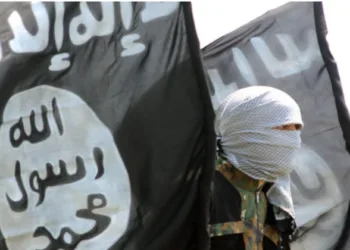 A militant with an Islamic Flag