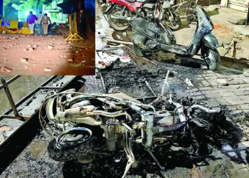 Charred remains of a vehicle is seen after a clash broke out between two groups at Hansapuri area in Nagpur on March 17