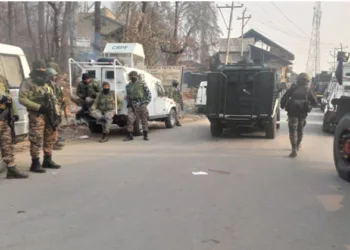 Armed security personnel standing as the search operation is underway in Kathua