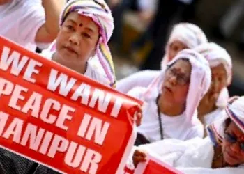 Women holding placards urging for peace