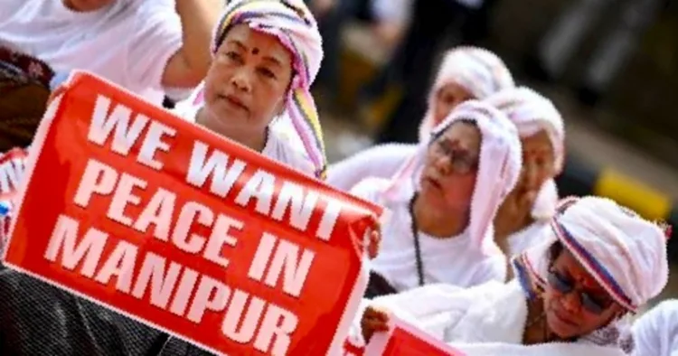 Women holding placards urging for peace