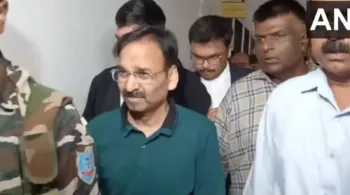 ACB officials arrest IAS Vinay Chaubey (in green t-shirt) in connection with liquor scam case, image courtesy ANI