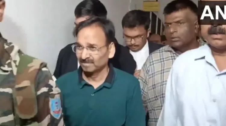 ACB officials arrest IAS Vinay Chaubey (in green t-shirt) in connection with liquor scam case, image courtesy ANI