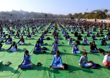 Students performing yoga in school (Image: Shotterstock)