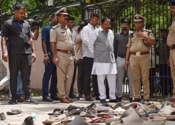 Officials at the site of the stampede