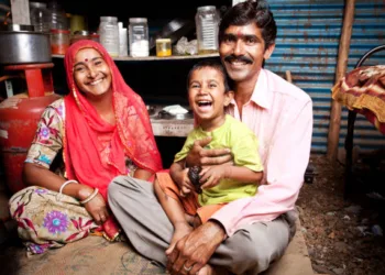 Cheerful Rajasthani Rural Indian Mother, Father, and Son (Image used for representative purpose)