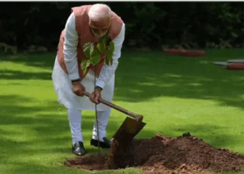 PM Narendra Modi planting a sapling given to him by 1971 war women of Bhuj