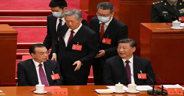 Hu Jintao, Ex- Chinese president and main rival of Xi, can be seen being escorted out of a key Communist Party meeting during a five-yearly leadership reshuffle apparently at Xi Jinping's behest.