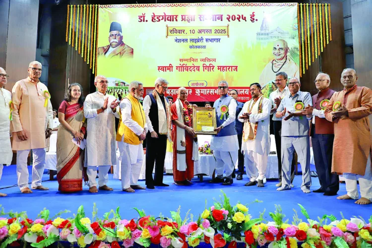 Pujya Swami Govinddev Giri Maharaj being conferred with the Dr Hedgewar Pragya Samman by Hon’ble Governor of Sikkim Om Prakash Mathur. Also seen (from left): Mahavir Prasad Rawat, Mahavir Bajaj, Dr Tara Dugad, Sajan Bansal, Lakshminarayan Bhala, Sajjan Kumar Tulsiyan, Mukul Kanitkar, Prof Ajay Pratap Singh, Banshidhar Sharma, Bhagirath Chandak, and Arunprakash Mallawat