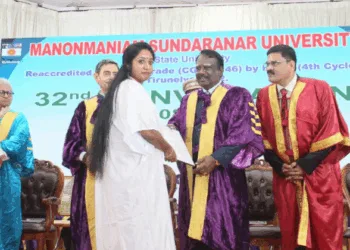 PhD scholar Jean Joseph receiving doctarate from VC, Governor RN Ravi on stage.