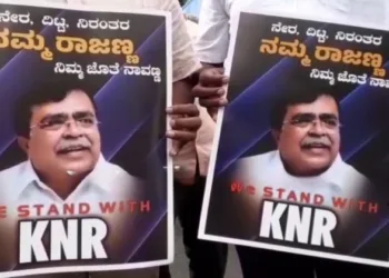 Supporters of KN Ranjanna holding the posters