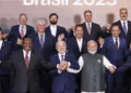 In this image via PMO on July 7, 2025, Prime Minister Narendra Modi, Brazil's President Luiz Inacio Lula da Silva and South Africa's President Cyril Ramaphosa during a group photograph with BRICS members, partners and outreach invitees at the BRICS Summit 2025, in Rio de Janeiro, Brazil.