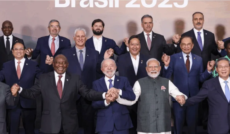In this image via PMO on July 7, 2025, Prime Minister Narendra Modi, Brazil's President Luiz Inacio Lula da Silva and South Africa's President Cyril Ramaphosa during a group photograph with BRICS members, partners and outreach invitees at the BRICS Summit 2025, in Rio de Janeiro, Brazil.