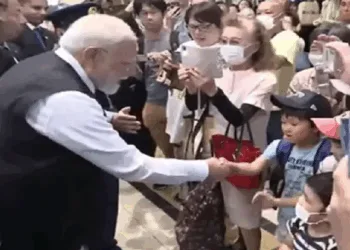 PM Narendra Modi greets children and others in Japan